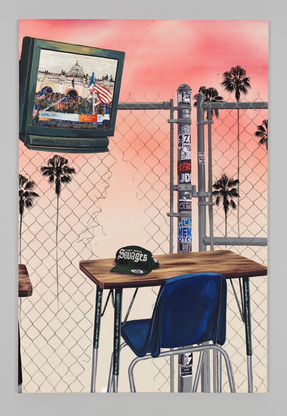 A classroom desk with a green cap sits in front of a fence, TV shows Capitol riot news coverage.