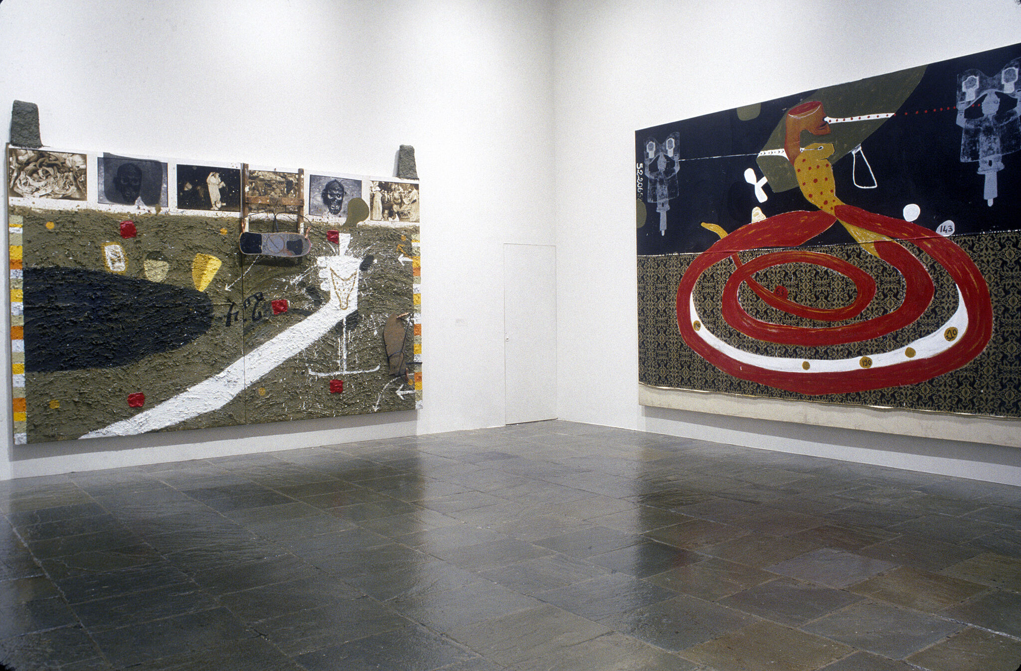 Two mixed media canvases displayed in a gallery at the Whitney.