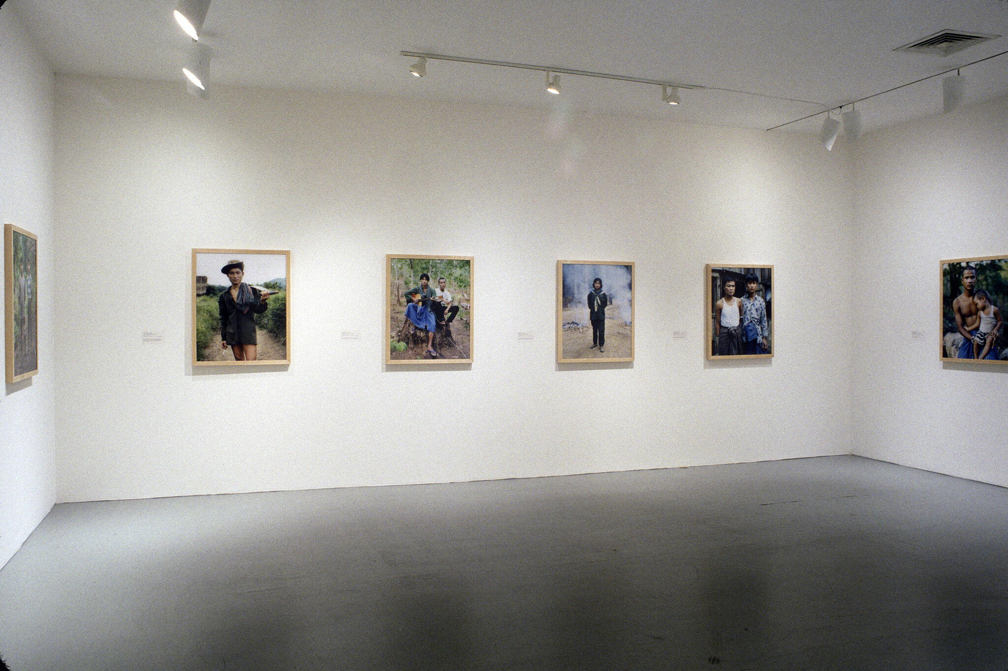 A gallery filled with photographs of people.