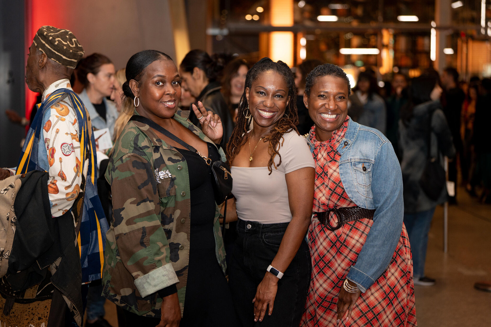 Visitors pose for a picture in the Museum lobby
