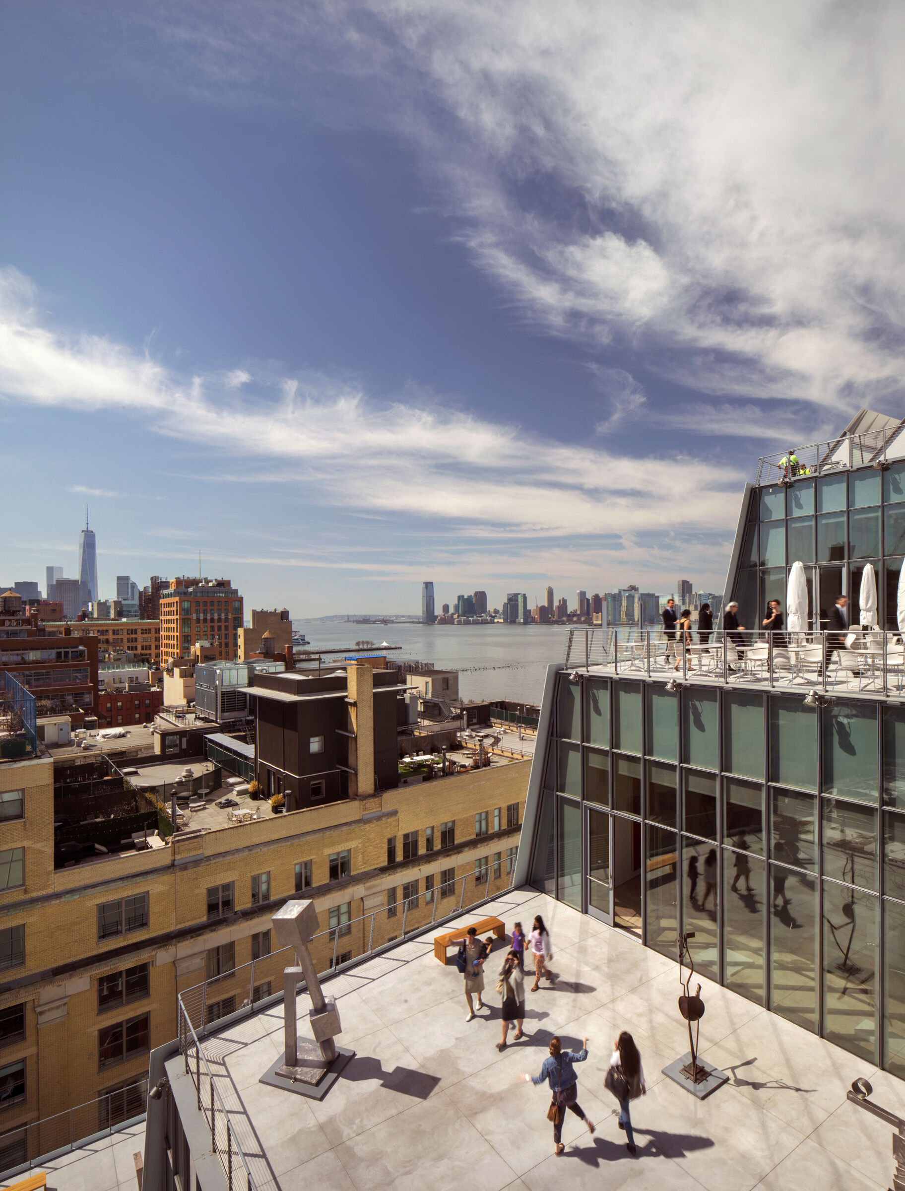 A view of the terrace and a city view on a sunny day.