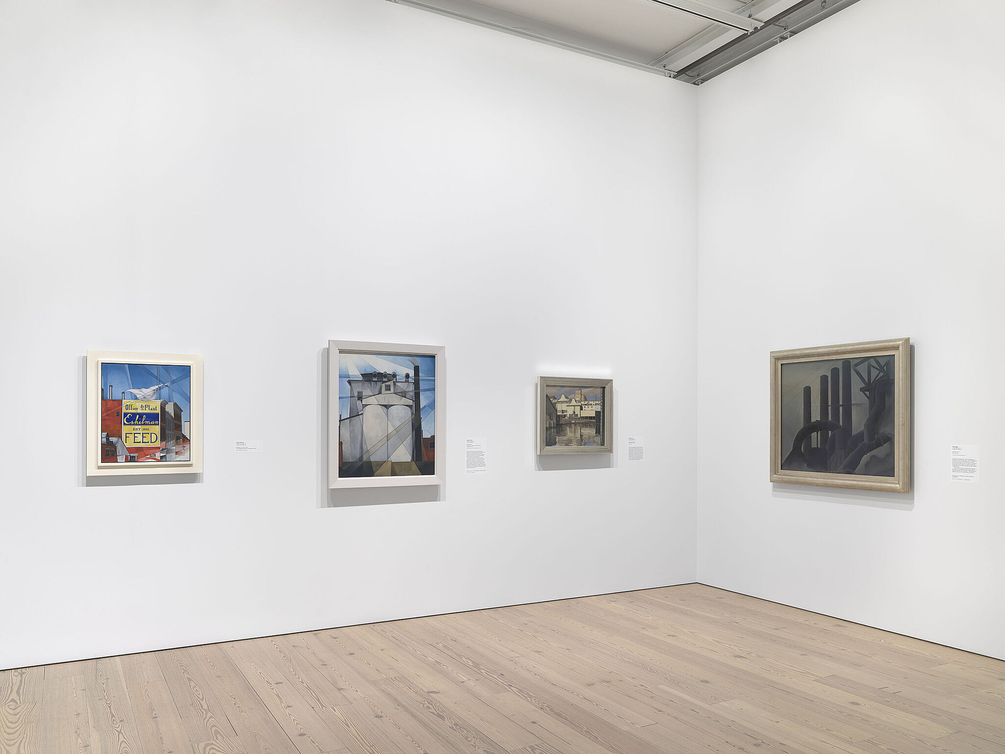 An image of the Whitney galleries with paintings on the wall