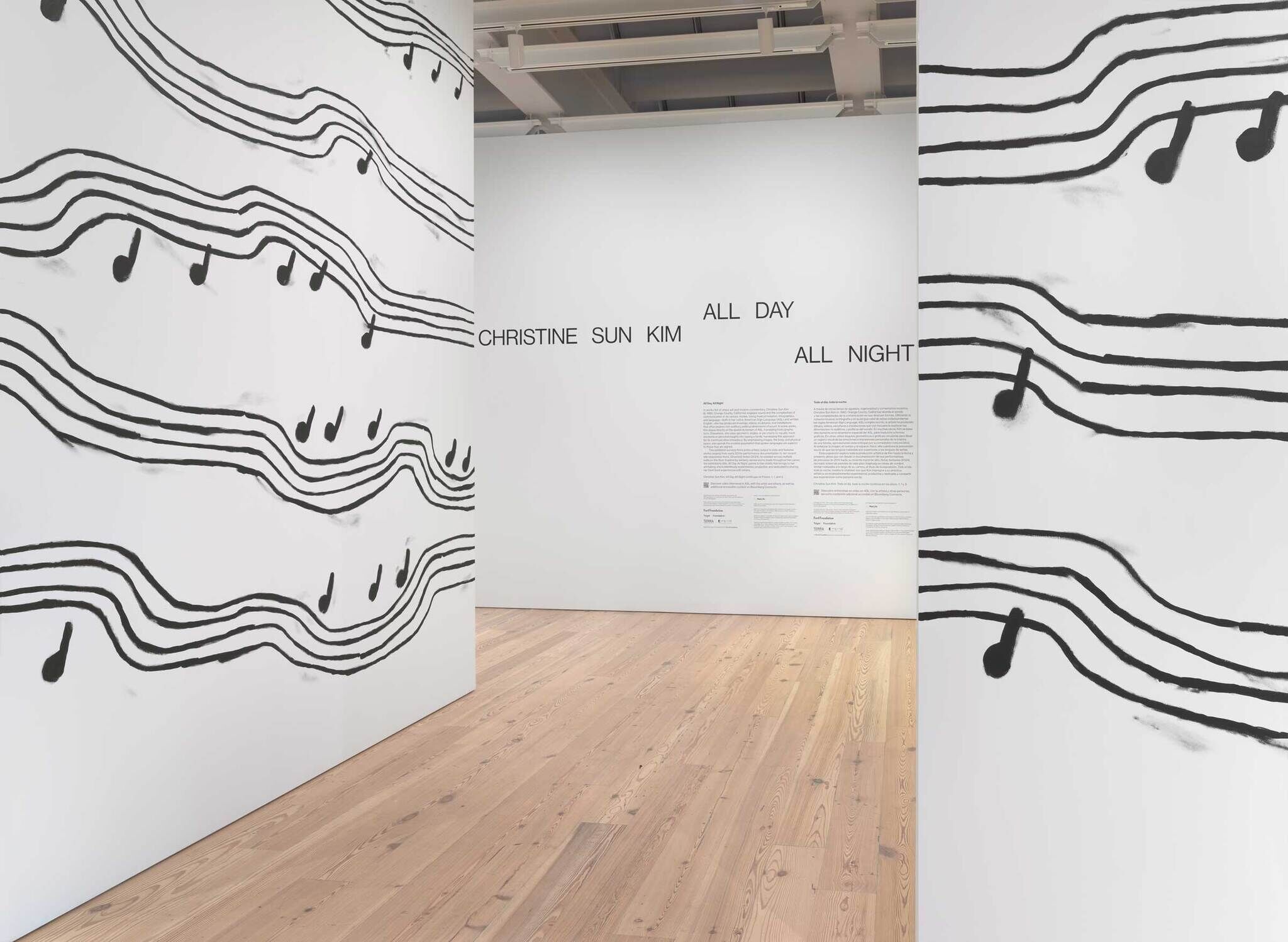 Gallery with musical notes painted on walls and text reading "Christine Sun Kim All Day All Night."