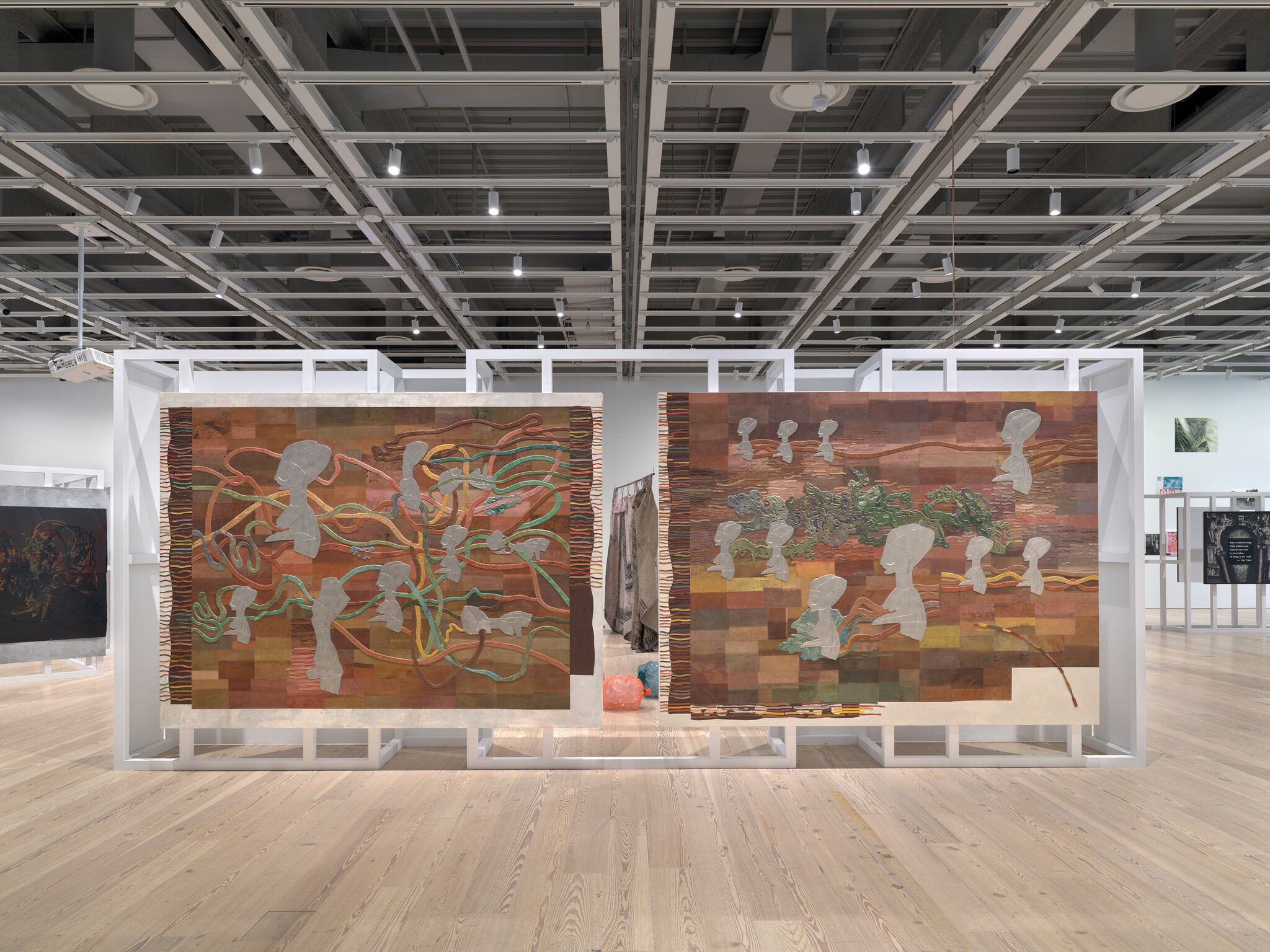 Two artworks in a light-filled gallery.