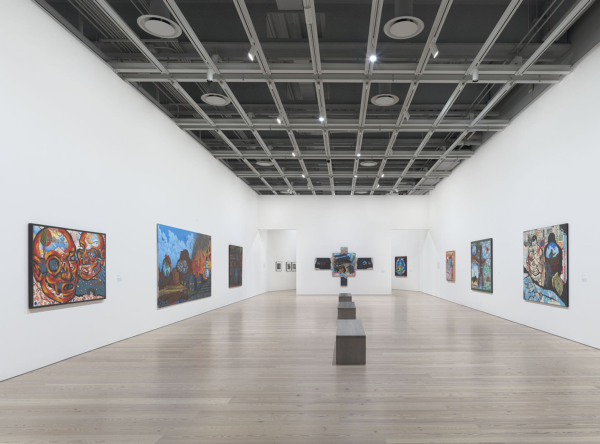 An image of the Whitney galleries with various artworks on the wall